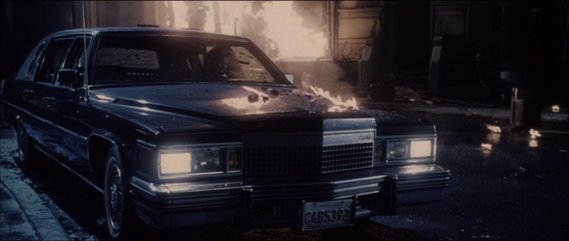 (1:35:55) He crawls into the front seat and drives away.